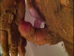 Horny guy jerking off his hard dick while covered in shit
